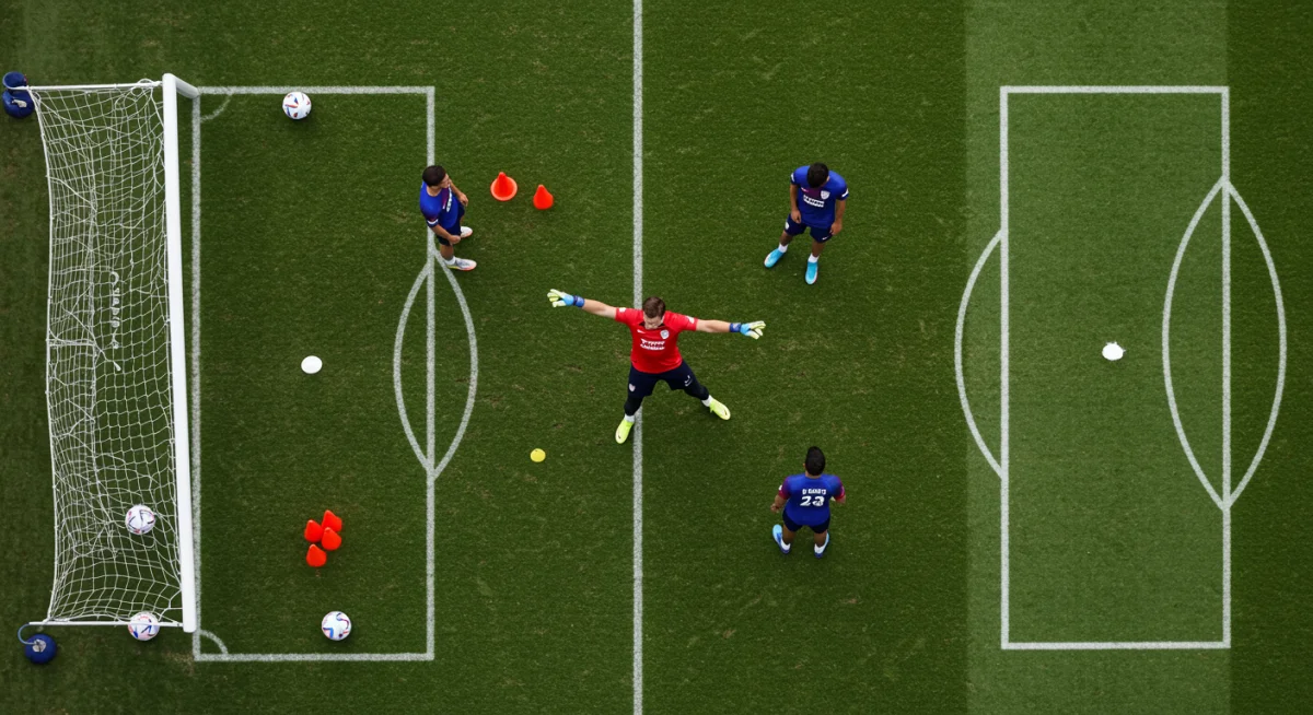 US goalkeeper directing defenders during a tactical training session