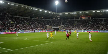 Dynamic soccer action during a high-stakes international friendly match.