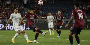 Soccer player making a crucial pass during a 2025 MLS match, illustrating attacking brilliance.