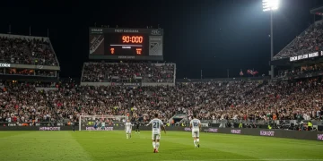 Player celebrates dramatic 90th-minute MLS goal in a packed stadium