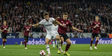 Central defender making a crucial tackle in a European football match